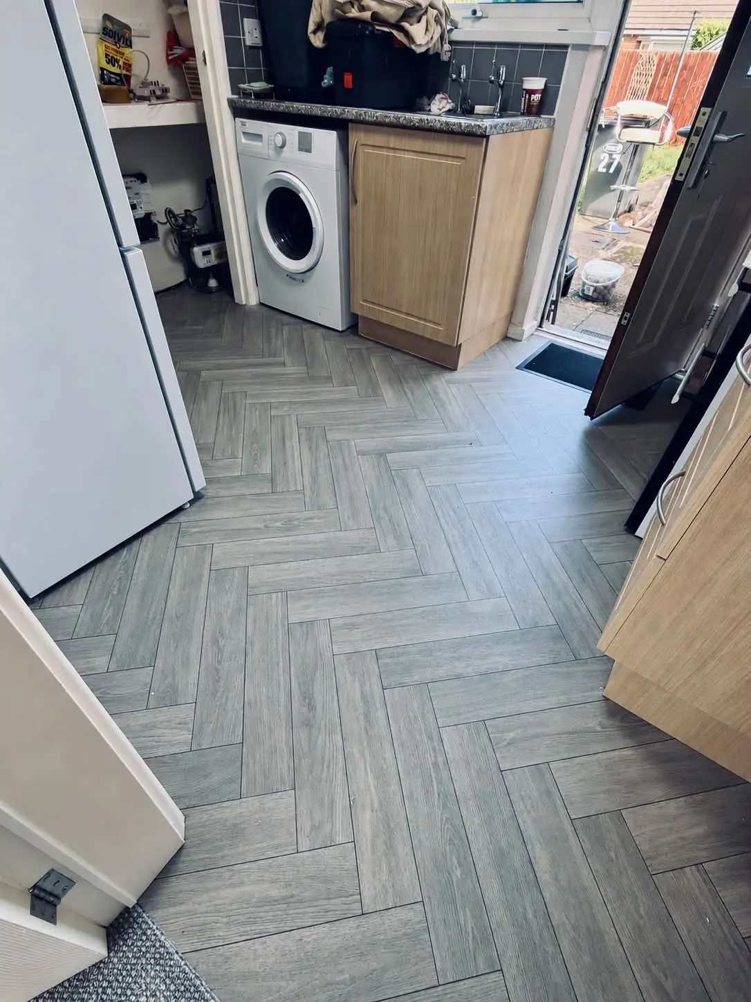 Grey wood-effect vinyl flooring fitted in a Newton Aycliffe kitchen