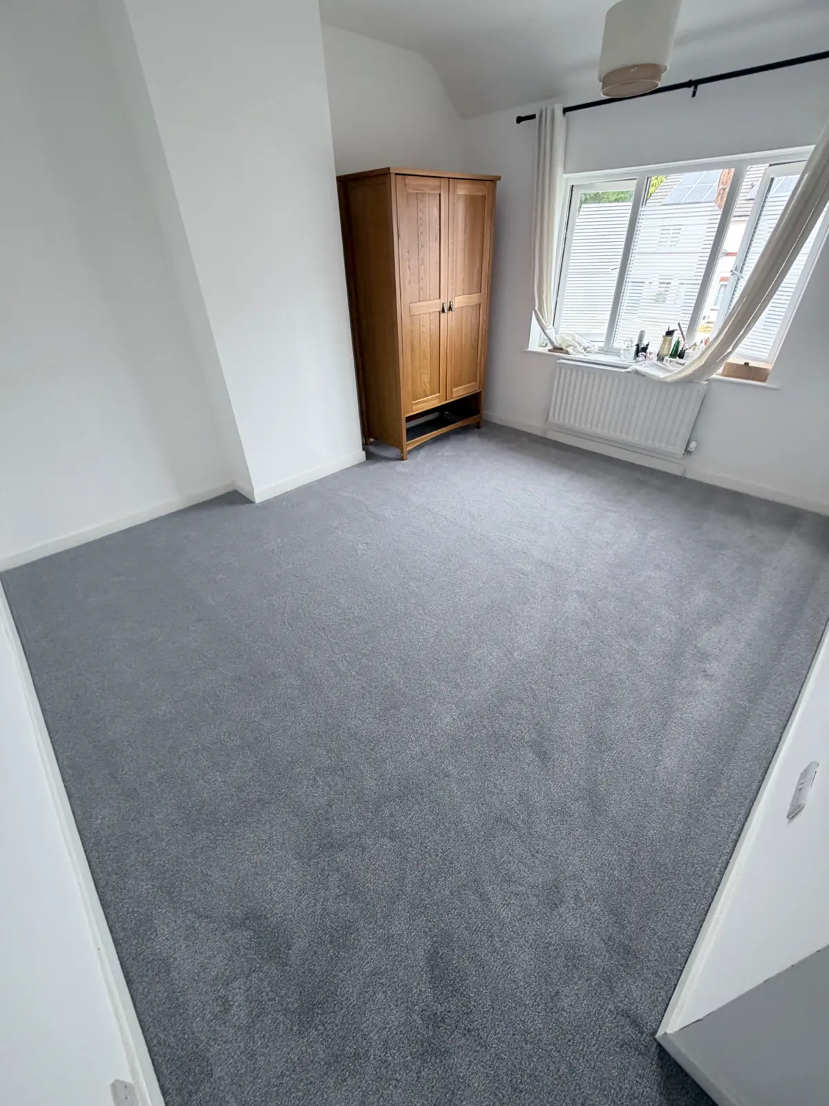 Grey bedroom carpet fitted in a Darlington home