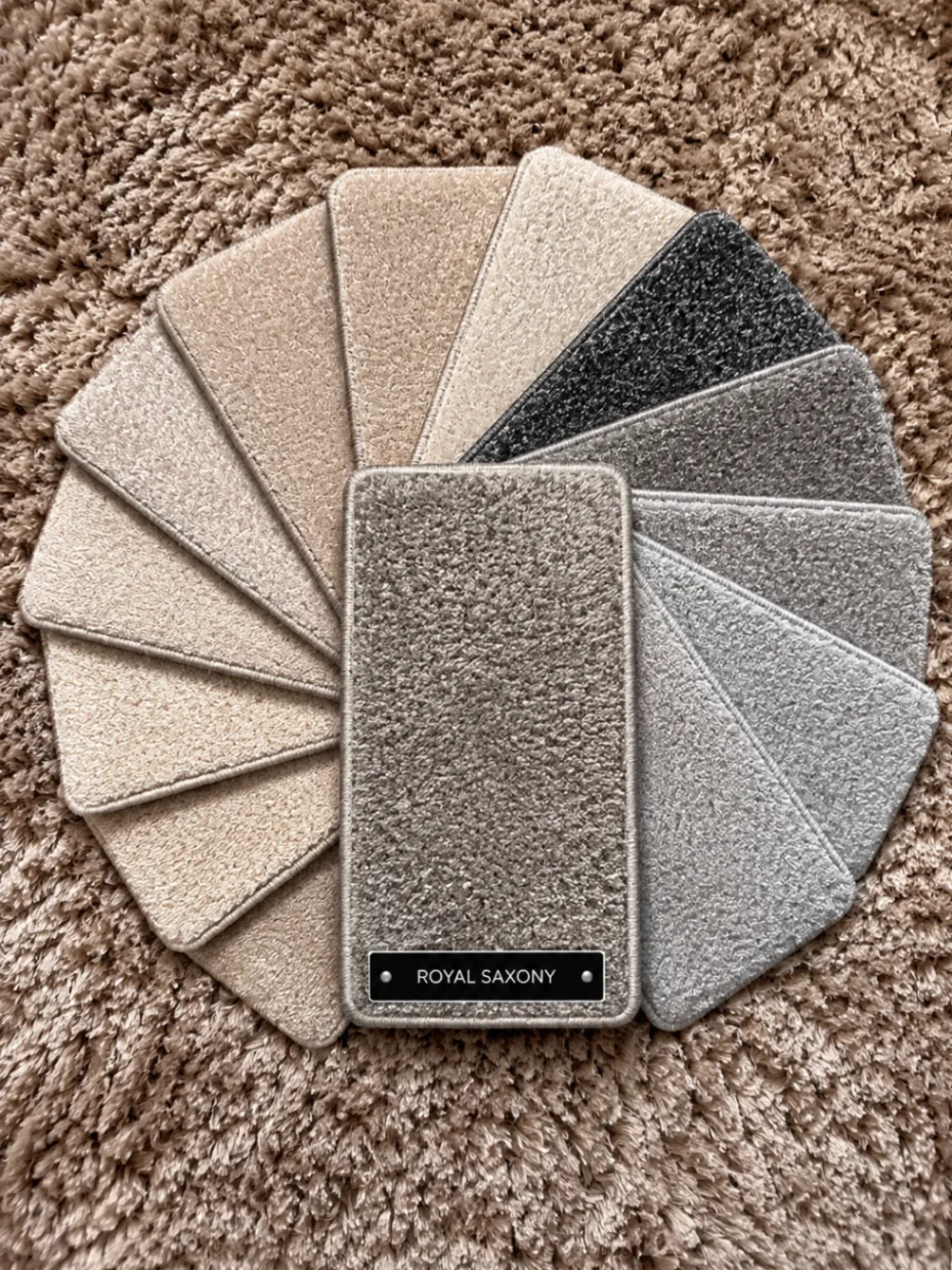 Royal Saxony carpet samples in a fan of cream, beige, taupe, silver grey and charcoal saxony pile