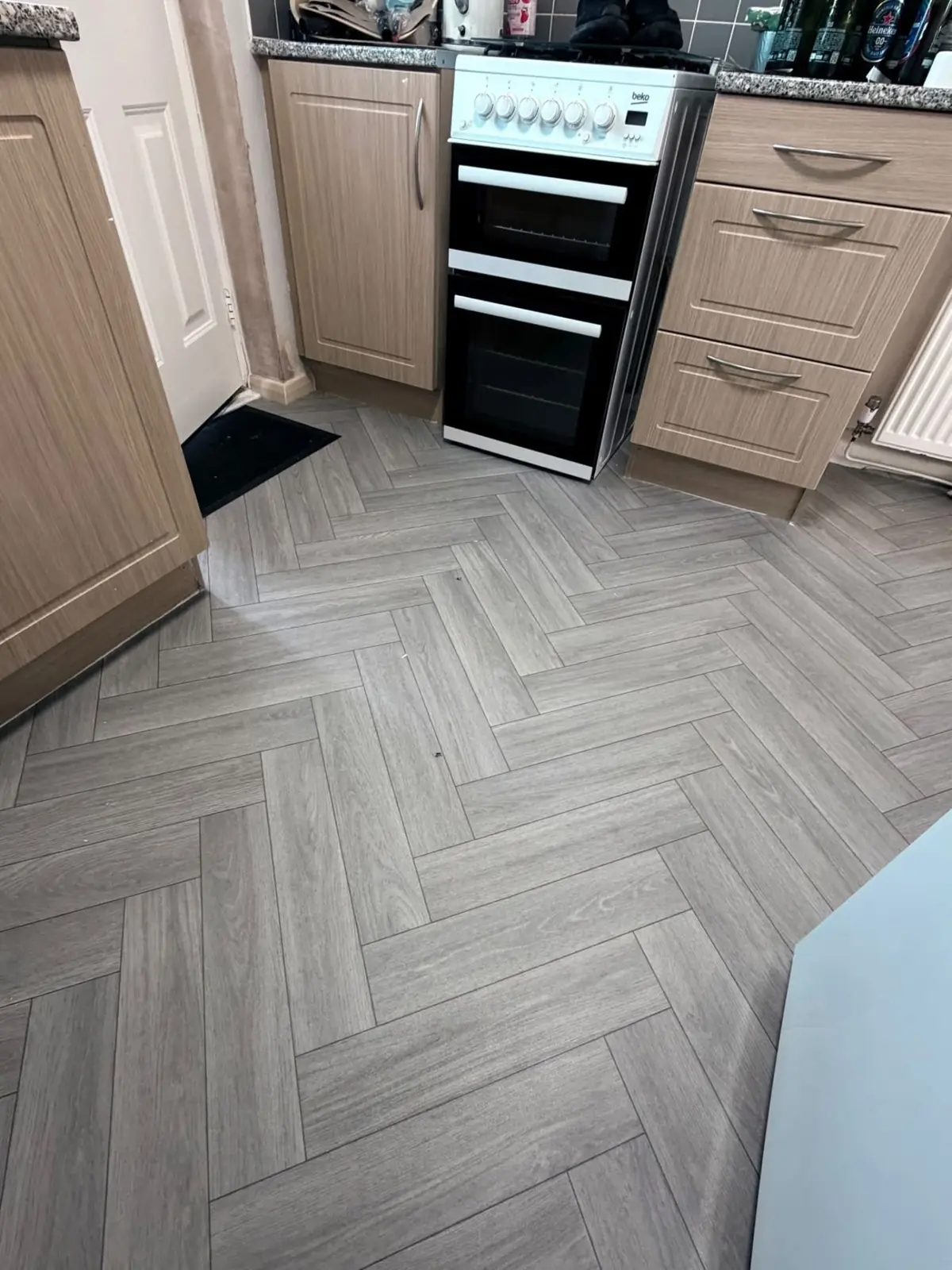 Herringbone pattern vinyl flooring fitted in a kitchen in Newton Aycliffe