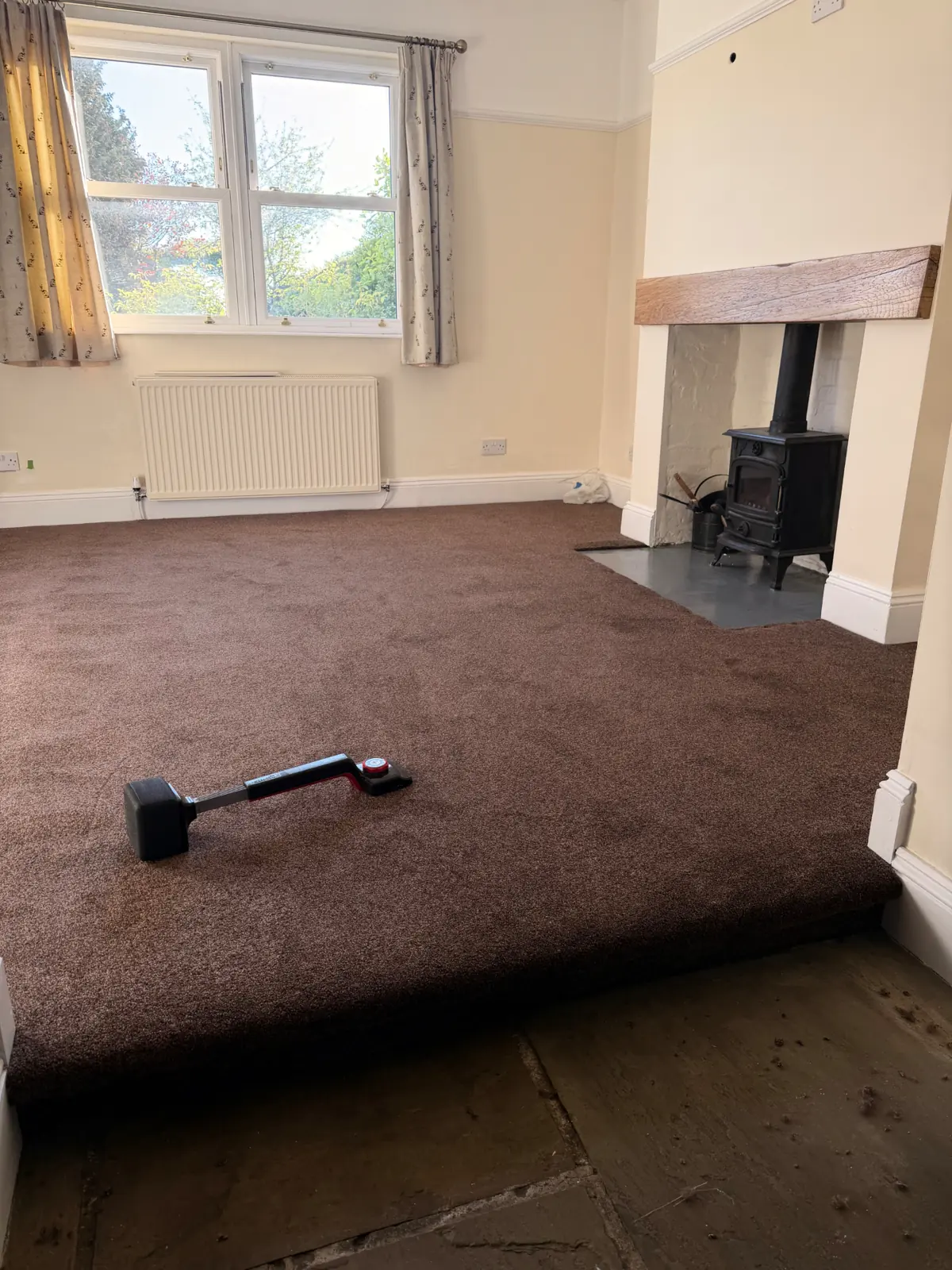 Dining room carpet being rolled out over new underlay in Bishop Auckland