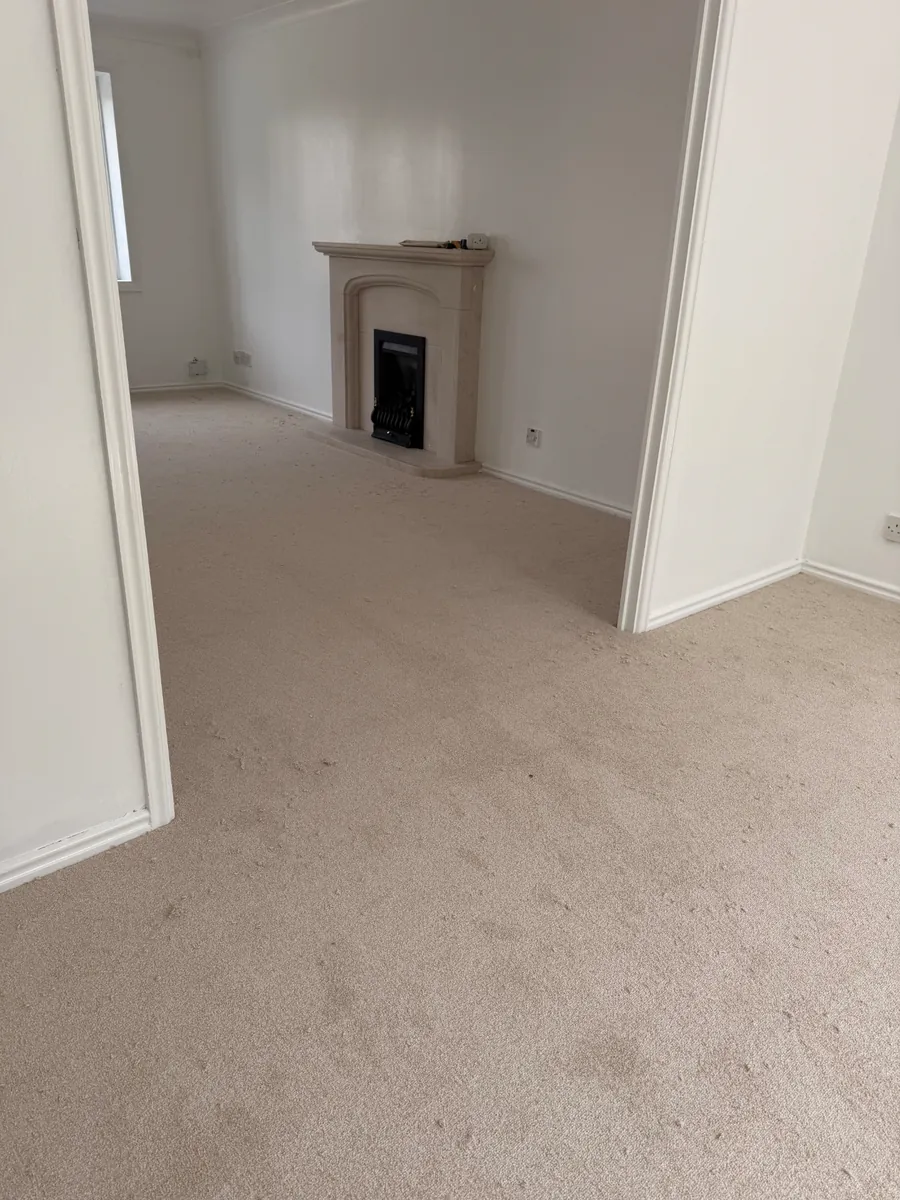 Lounge carpet fitted around a stone fireplace in Yarm