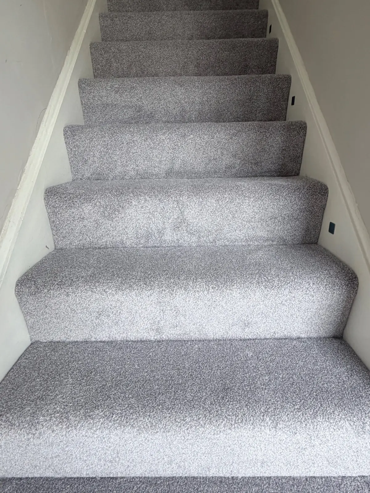 Light grey carpet fitted to stairs and landing in Darlington